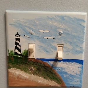 Hand painted electrical outlet cover.